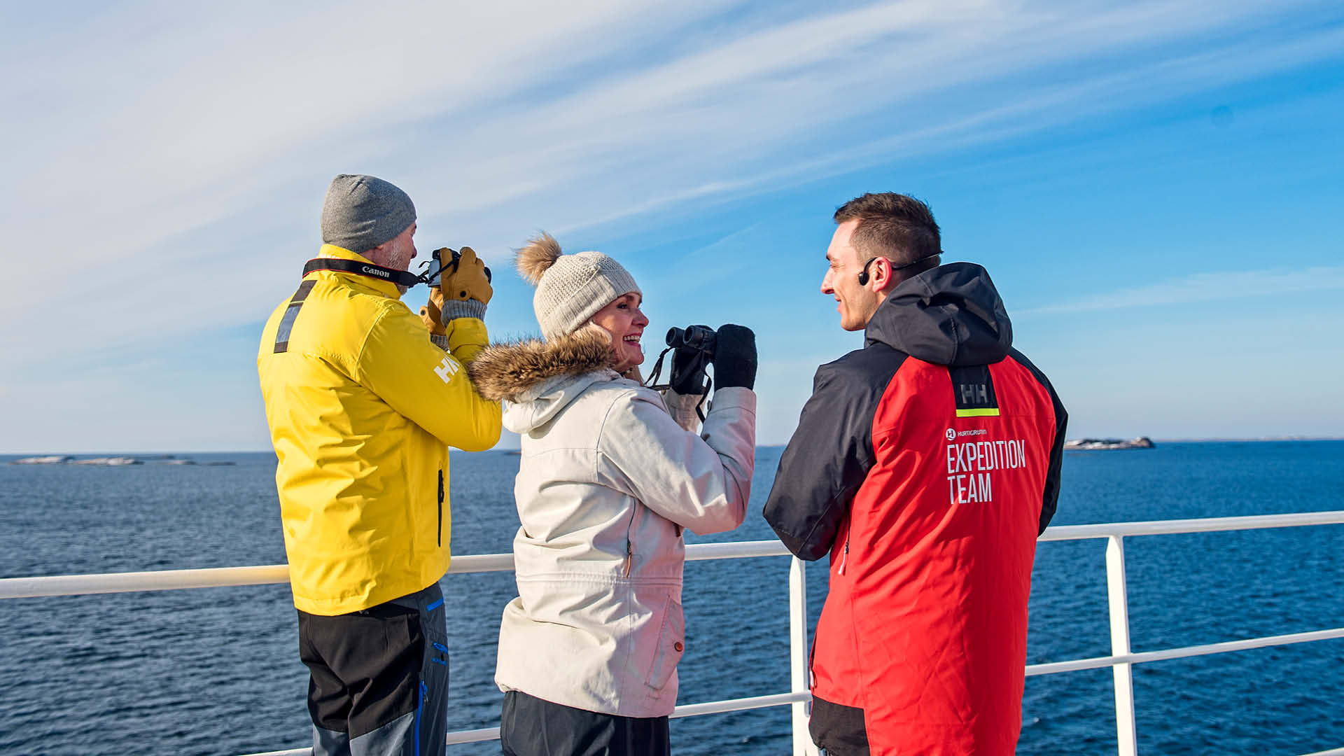 Passengers standing on deck with Expedition Team, Kong Harald, Hurtigurten Fleet