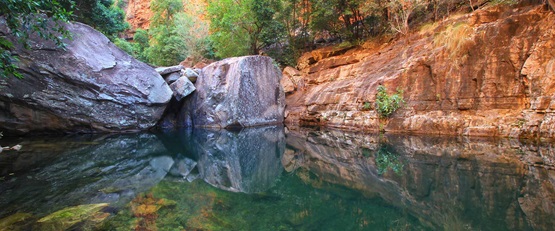 Close up of Emma Gorge, rock face reflecting into turquoise pool