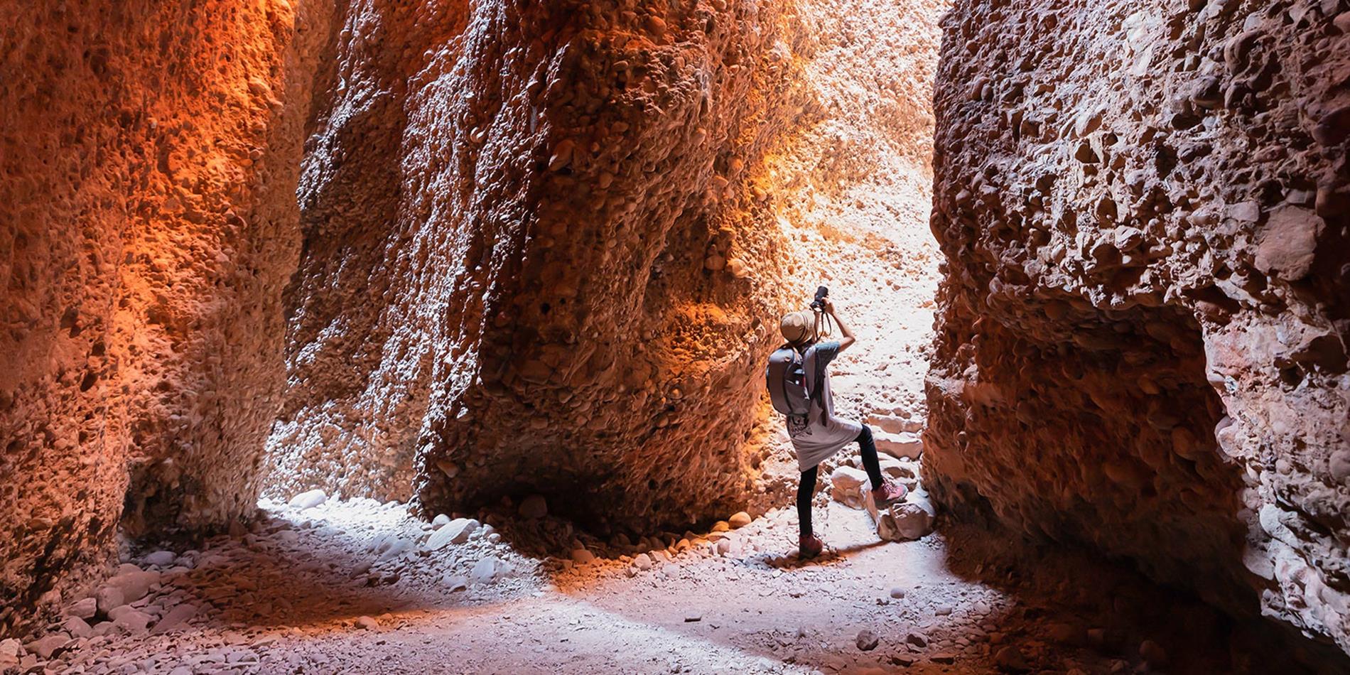 A person taking a photo of Echidna Chasm
