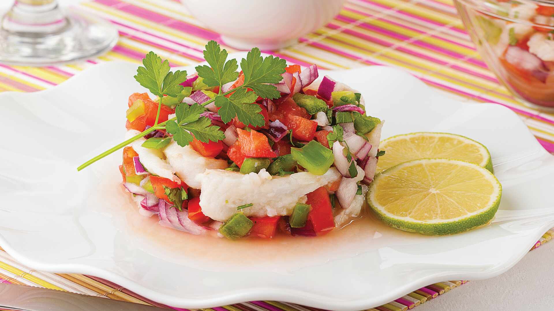 Plate of seafood ceviche with lime