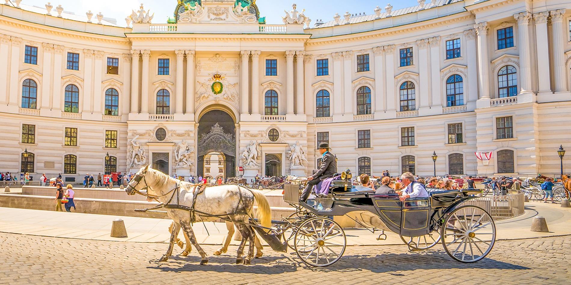 Tourists sightseeing in Alte Hofburg, Vienna, Austria
