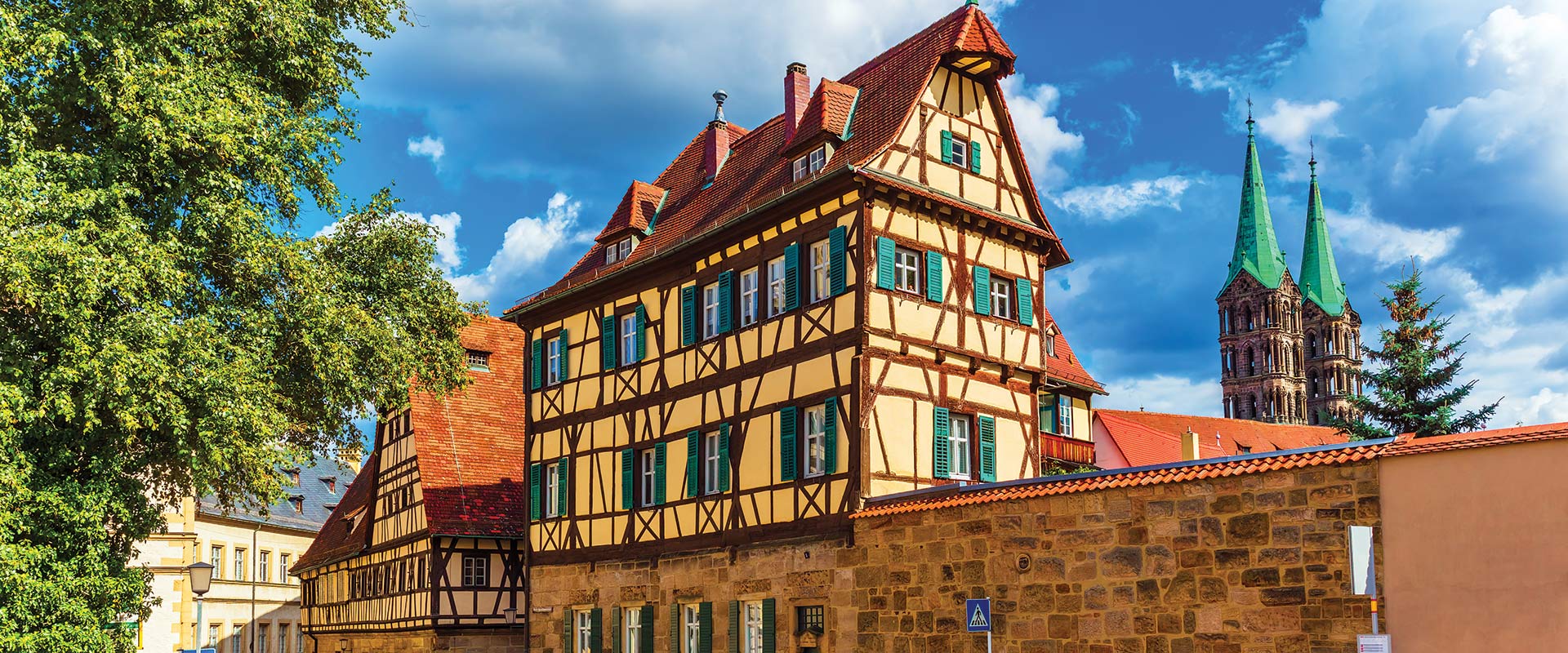 Historical building with yellow facade and red roof and framework, Bamberg