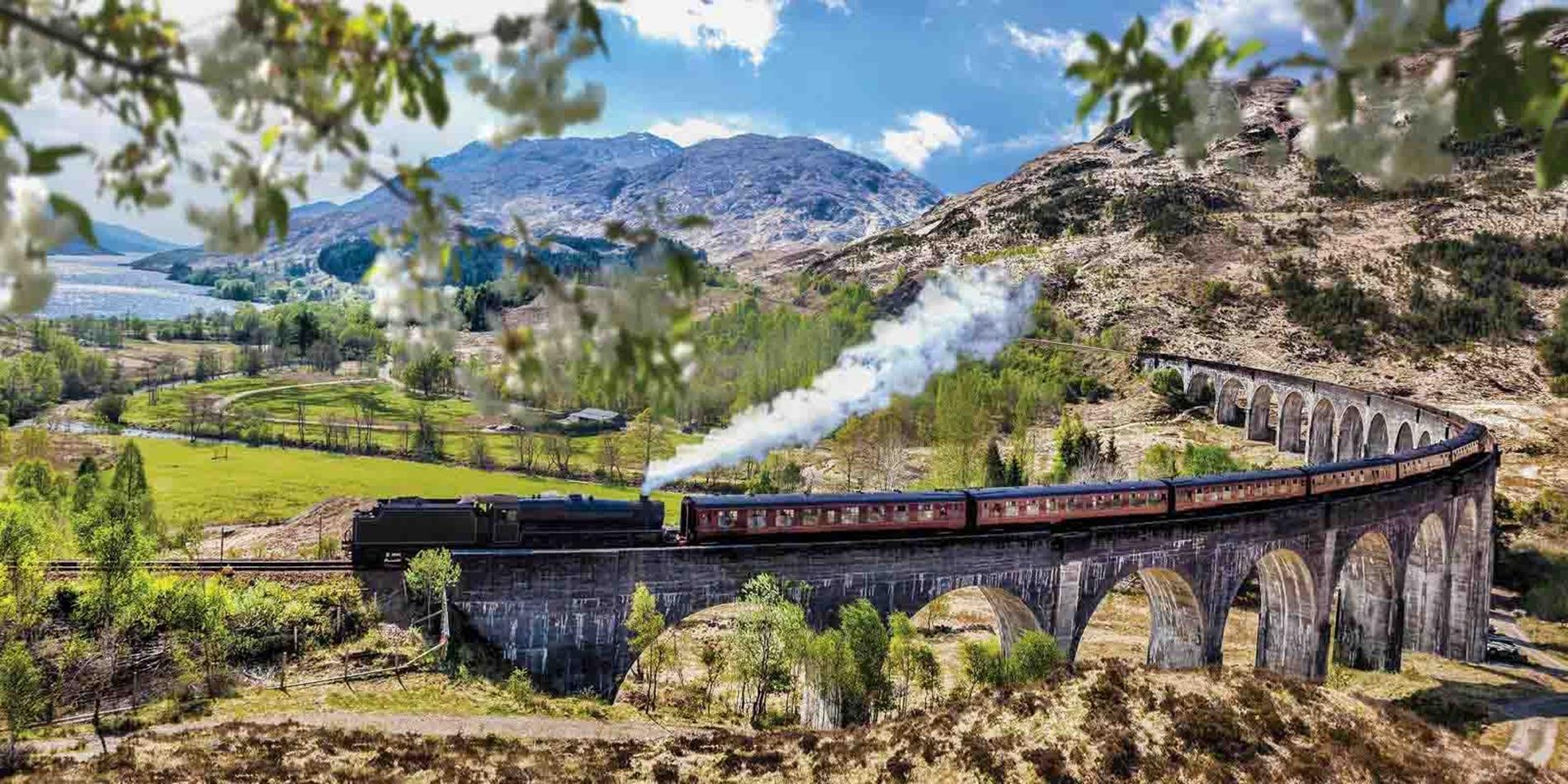 The Jacobite Steam Train travelling over the Glennfinnan Viaduct