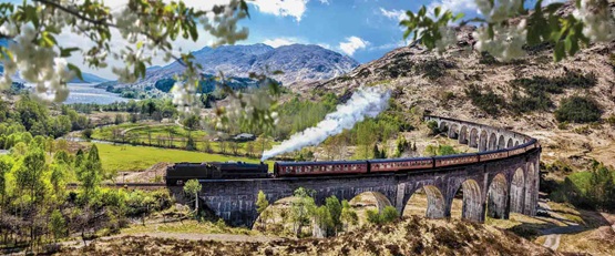 The Jacobite Steam Train travelling over the Glennfinnan Viaduct