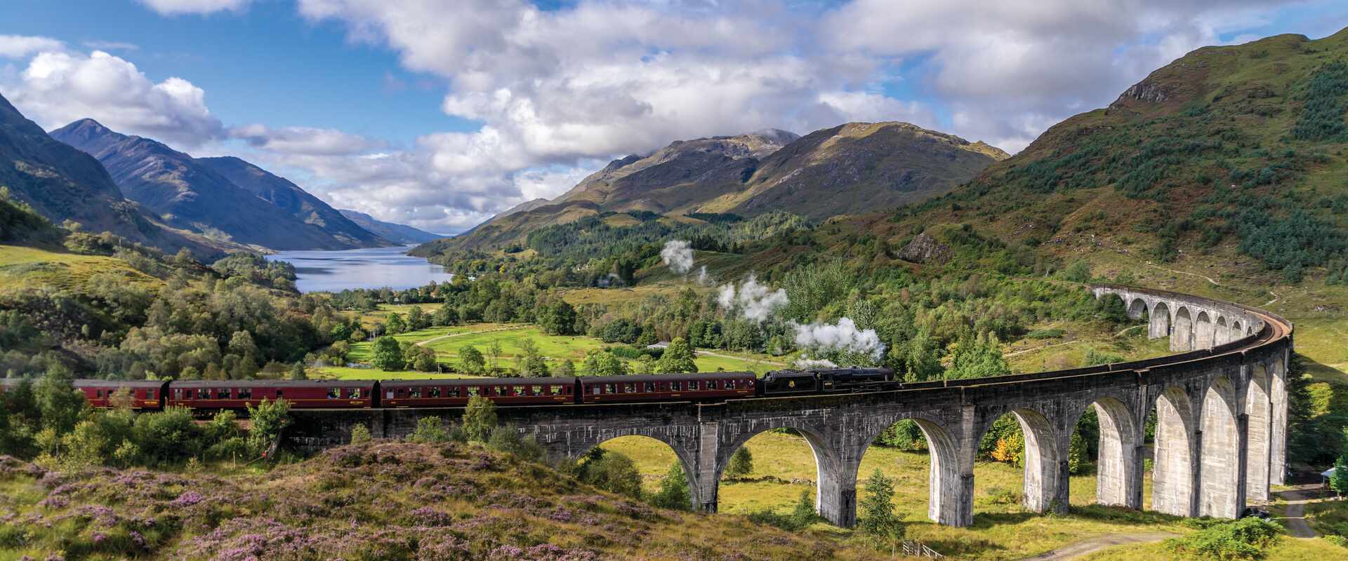 Jacobite Steam Train travelling over the Glenfinnan Viaduct, Scotland
