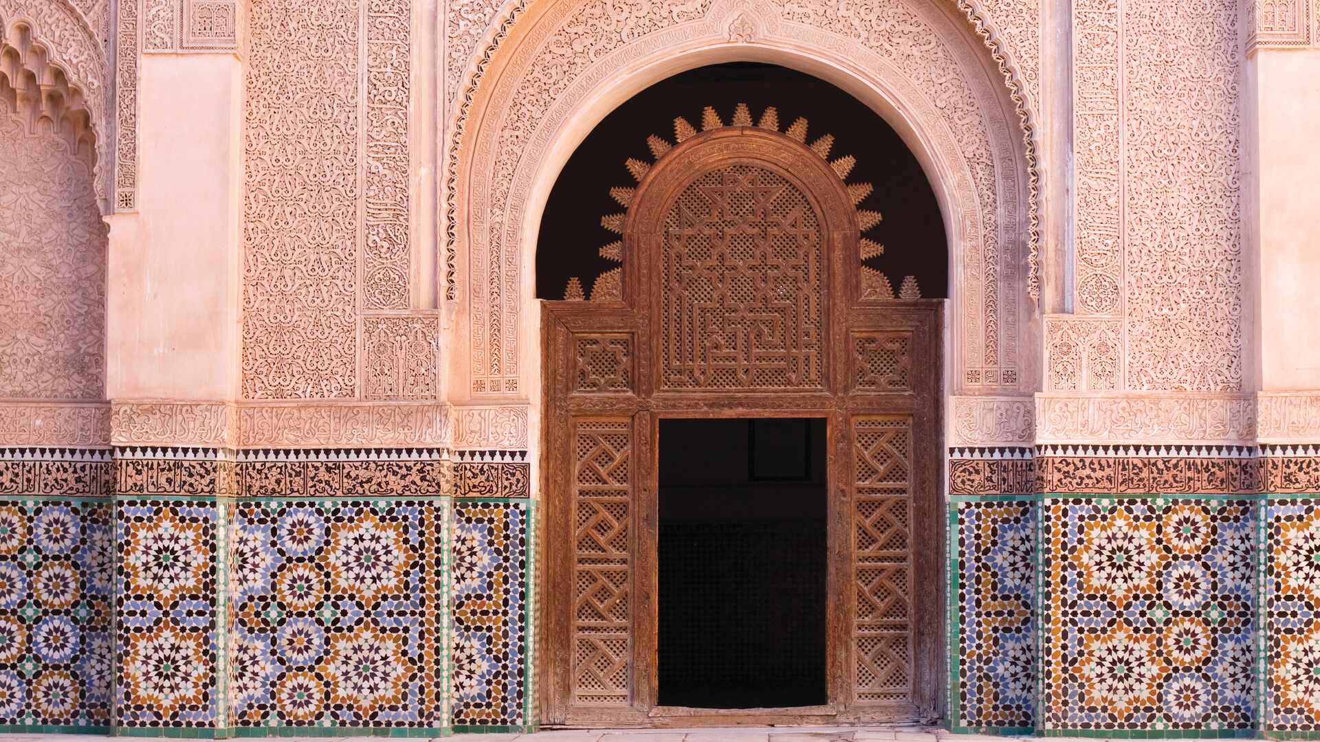 ben youssef madrasa door marrakesch morocco 16 9