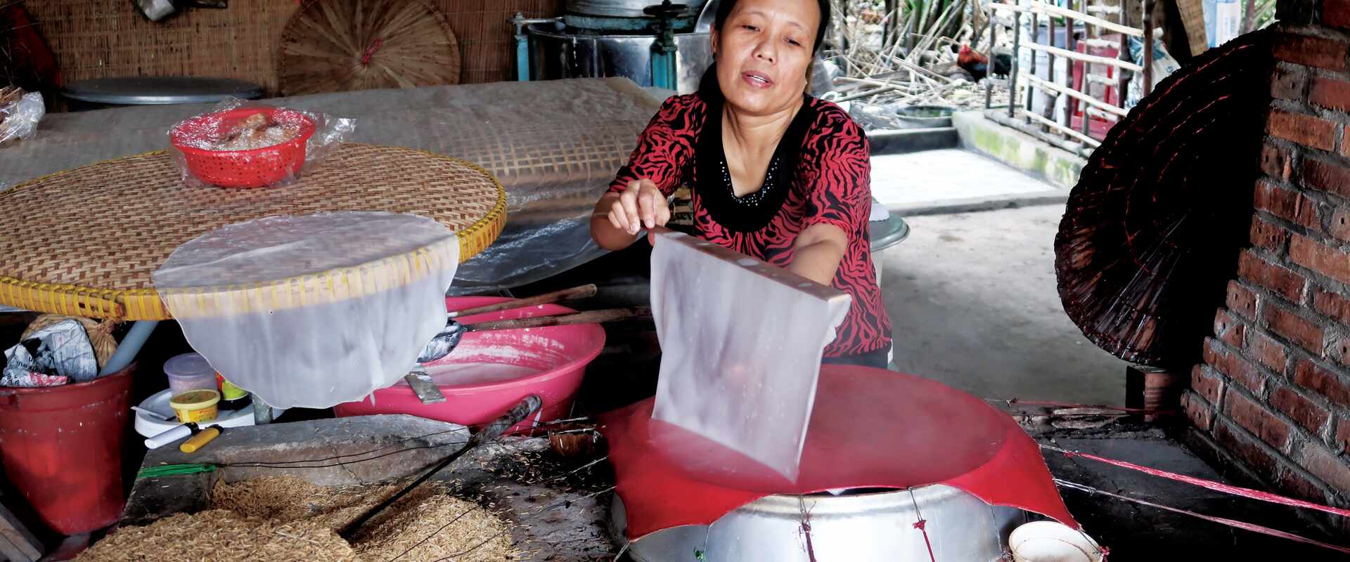 cai be rice paper coconut candy lady in kitchen