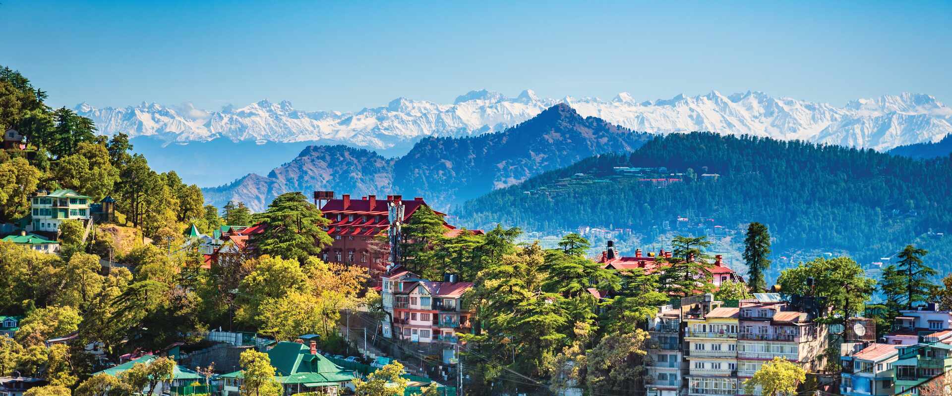 Panorama of Shimla cityscape with Himalayas in background, India
